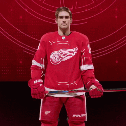 A Hockey Player Wearing A Red Bauer Jersey GIF