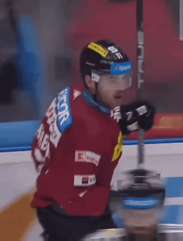 A Hockey Player Wearing A Red Jersey That Says Hiabik On The Back GIF