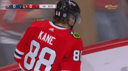 A Hockey Player Wearing A Red Jersey With Kane 88 On The Back GIF