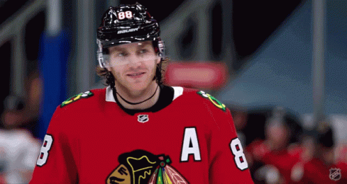 A Hockey Player Wearing A Red Jersey With The Letters B And A On It GIF