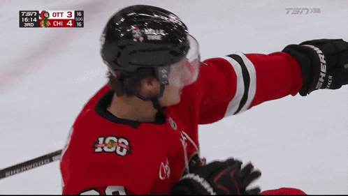 A Hockey Player Wearing A Red Jersey With The Letters Iog On It GIF