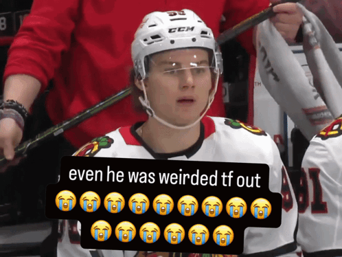 A Hockey Player Wearing A White Helmet With The Number 55 On It GIF