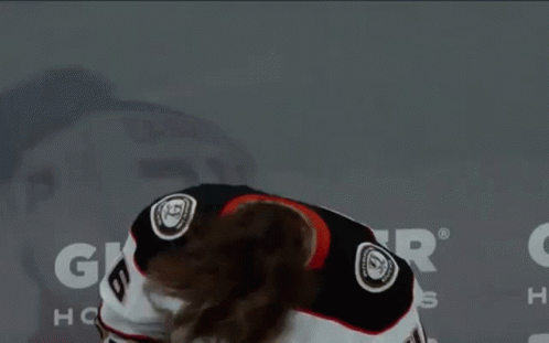 A Hockey Player Wearing A White Jersey With The Number 6 On It GIF
