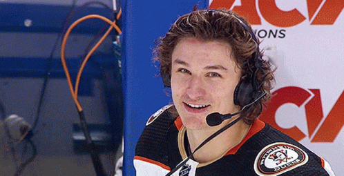 A Hockey Player Wearing Headphones And A Jersey That Says ' Washington Ducks ' On It GIF