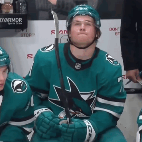 A Hockey Player With A Ccm Helmet Holds His Stick GIF