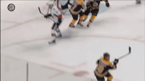 A Hockey Player With The Letter B On His Jersey Is Holding A Stick GIF