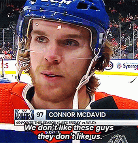 A Hockey Player With The Name Connor Mcdavid On The Bottom Of The Screen GIF
