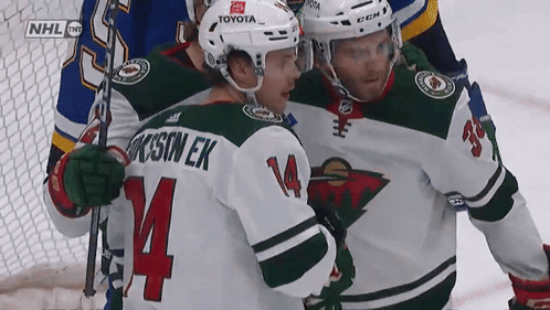 A Hockey Player With The Name Jackson Ek On His Jersey GIF
