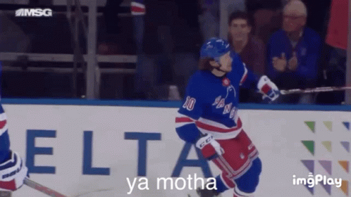 A Hockey Player With The Number 10 On His Jersey Stands On The Ice GIF