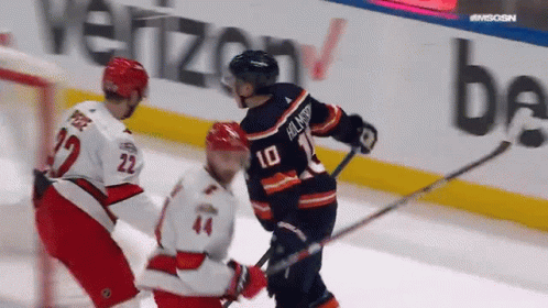 A Hockey Player With The Number 10 On The Back Of His Shirt GIF
