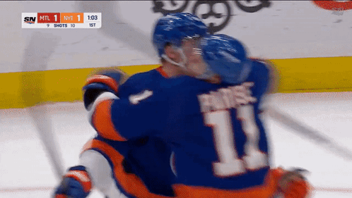 A Hockey Player With The Number 11 On His Back GIF