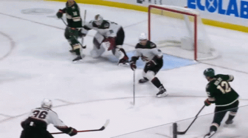 A Hockey Player With The Number 12 On His Back GIF