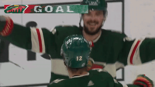 A Hockey Player With The Number 12 On His Jersey GIF