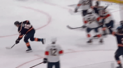 A Hockey Player With The Number 12 On The Back Of His Shirt GIF