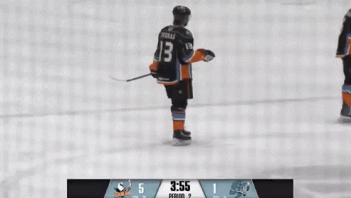 A Hockey Player With The Number 13 On His Jersey Is Standing On The Ice GIF
