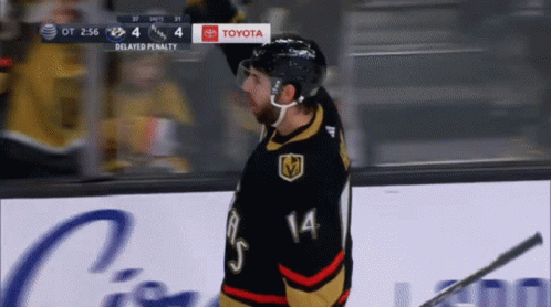 A Hockey Player With The Number 14 On His Shirt GIF