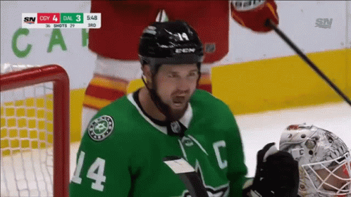 A Hockey Player With The Number 14 On Their Jersey GIF