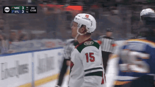 A Hockey Player With The Number 15 On His Jersey Stands On The Ice GIF