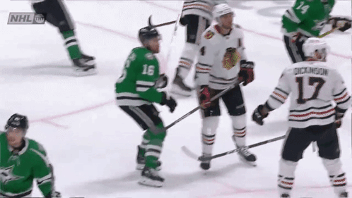 A Hockey Player With The Number 17 On His Jersey Stands On The Ice GIF