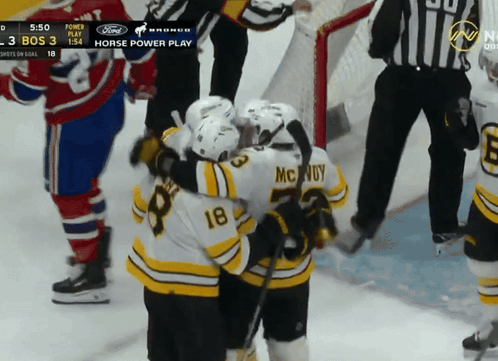 A Hockey Player With The Number 18 On His Back GIF