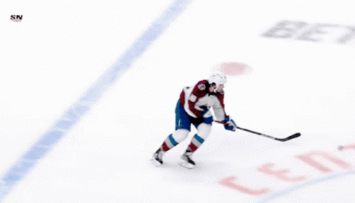 A Hockey Player With The Number 19 On His Back GIF