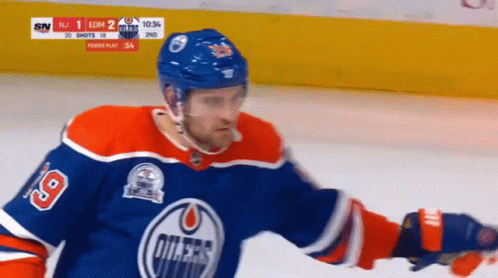 A Hockey Player With The Number 19 On His Shirt GIF