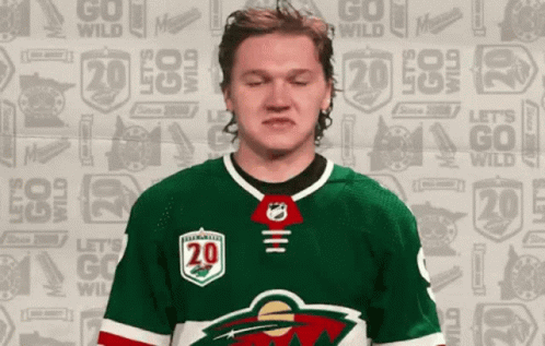 A Hockey Player With The Number 20 On His Shirt GIF