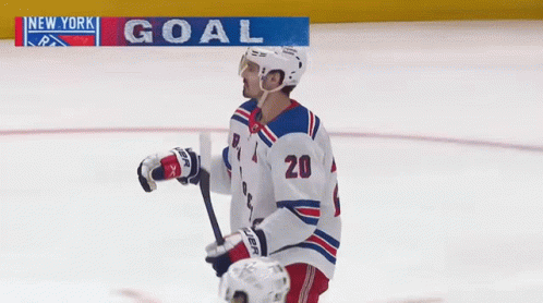 A Hockey Player With The Number 20 On Their Jersey GIF