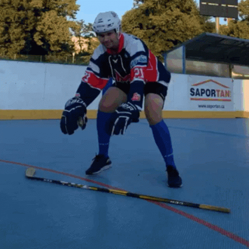 A Hockey Player With The Number 21 On His Jersey Stands On The Ice GIF