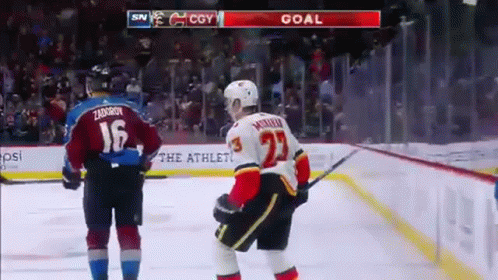 A Hockey Player With The Number 23 On His Back GIF