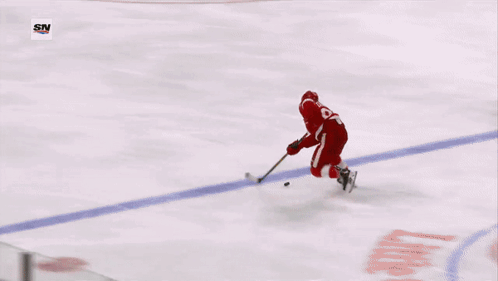 A Hockey Player With The Number 23 On His Jersey GIF