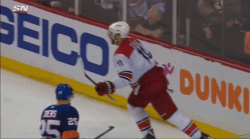 A Hockey Player With The Number 25 On His Jersey Stands On The Ice GIF