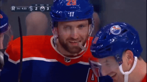 A Hockey Player With The Number 29 On His Helmet Is Smiling GIF