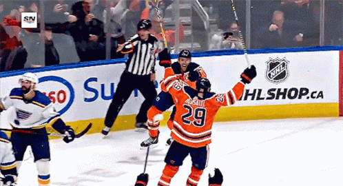 A Hockey Player With The Number 29 On His Jersey Celebrates His Goal GIF