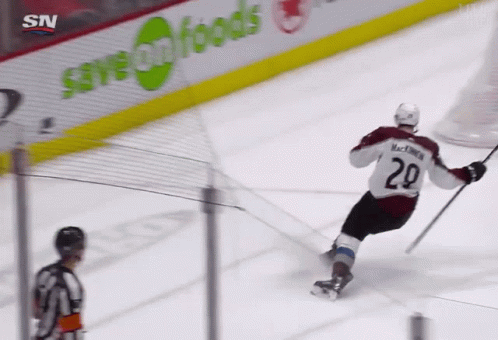A Hockey Player With The Number 29 On His Jersey Is Skating On The Ice GIF