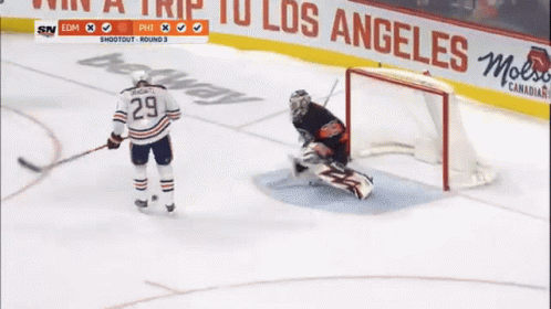 A Hockey Player With The Number 29 On His Jersey Stands On The Ice GIF