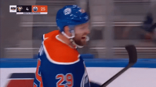 A Hockey Player With The Number 29 On His Shirt GIF
