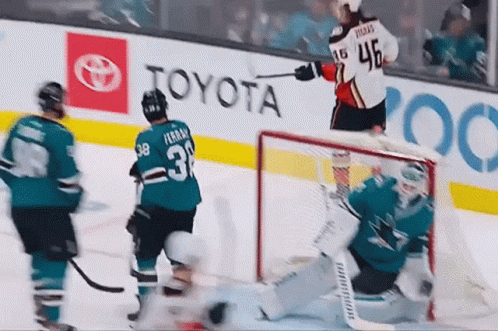 A Hockey Player With The Number 3 On His Jersey Stands On The Ice GIF
