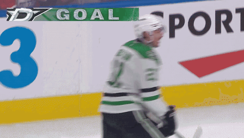A Hockey Player With The Number 3 On The Wall GIF