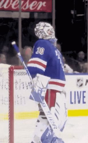 A Hockey Player With The Number 30 On His Jersey Stands On The Ice GIF