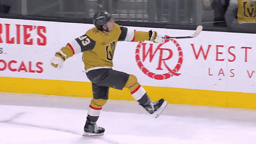 A Hockey Player With The Number 33 On His Jersey Skates On The Ice GIF