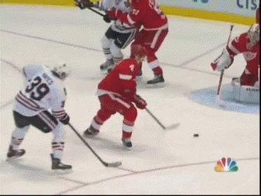 A Hockey Player With The Number 39 On His Jersey Stands On The Ice GIF