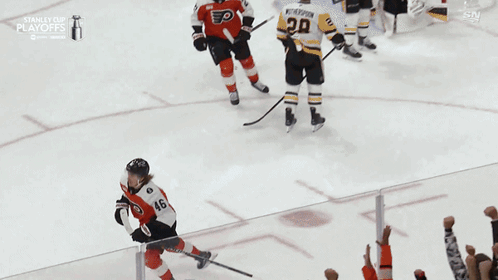 A Hockey Player With The Number 46 On His Jersey Is Being Lifted In The Air By Fans GIF
