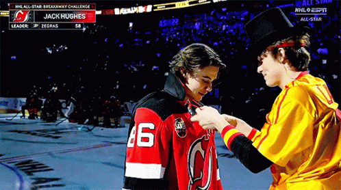A Hockey Player With The Number 46 On His Jersey Is Being Pinned GIF