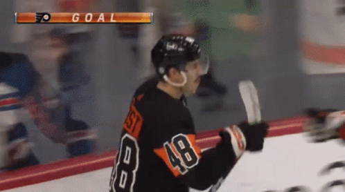 A Hockey Player With The Number 48 On His Back GIF