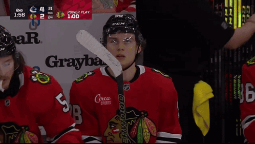 A Hockey Player With The Number 5 On His Back GIF