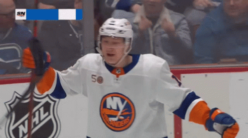 A Hockey Player With The Number 50 On His Jersey Celebrates GIF