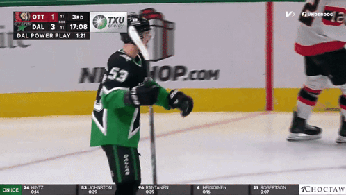 A Hockey Player With The Number 53 On His Jersey Stands On The Ice GIF