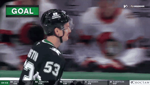 A Hockey Player With The Number 53 On His Jersey Stands On The Ice GIF