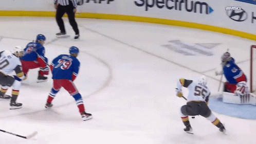 A Hockey Player With The Number 55 On His Back GIF